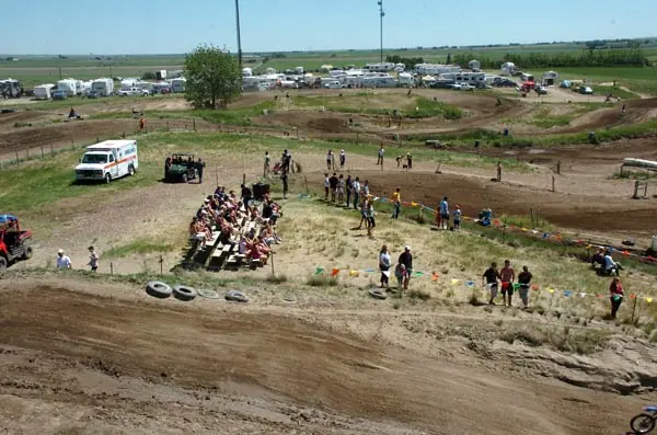 A view of Temple Hill’s dirt circuit, with spectators and campers around the course